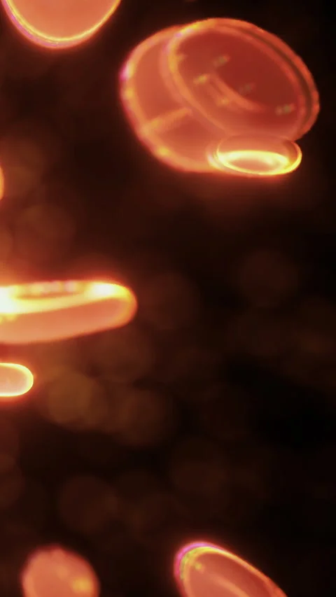 Light reflections create shapes in orange glow during night time activity Stock Footage 334885537