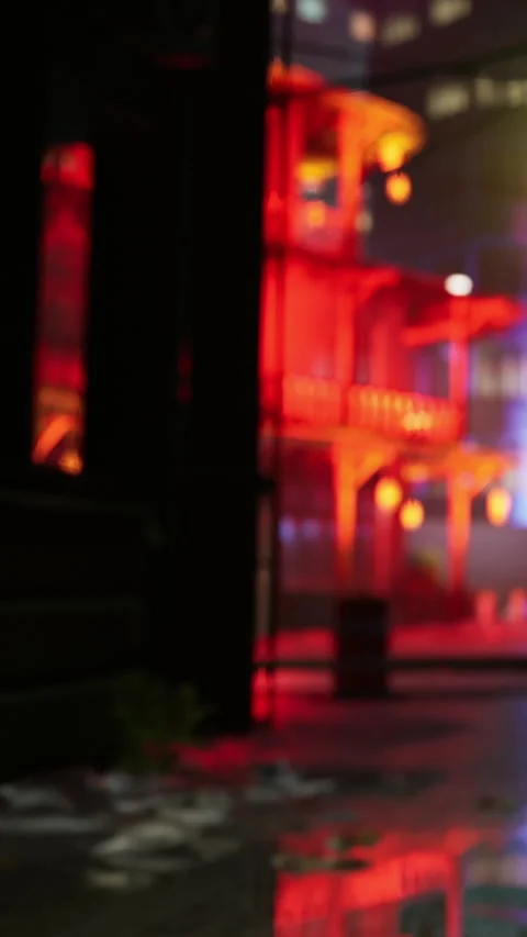 Light reflections on a rainy street at night with buildings in the background Stock Footage 341987073