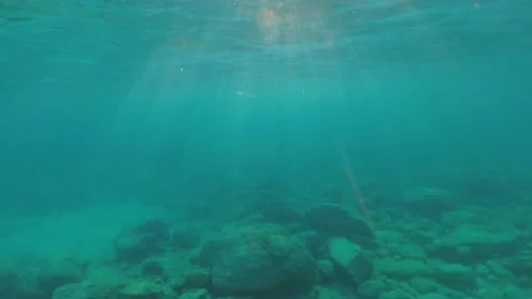 Light reflections underwater in clear blue sea waters Video stock 157821915