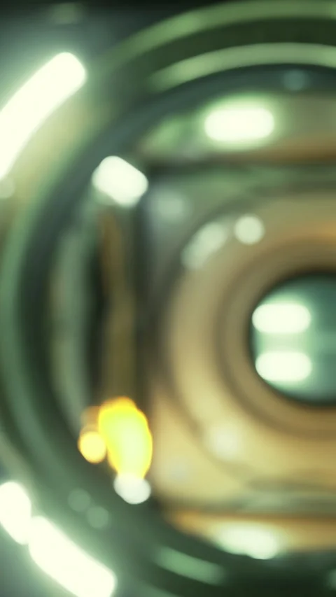 Light reflects off a circular object in a dim space with bright elements Stock Footage 336577509