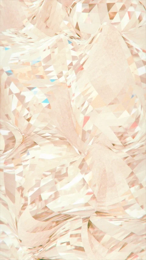 Light reflects off countless angled surfaces of a peach gemstone Stock Footage 325728148