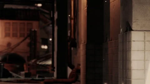 Light reflects off a tiled wall in an urban setting at night Stock Footage 339491509