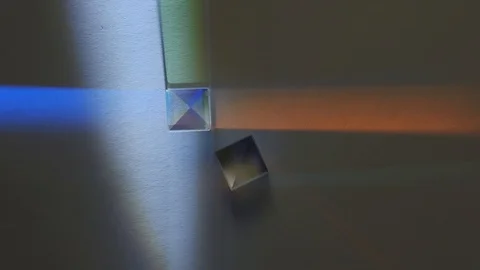 Light is refracted through prisms and divided into a spectrum Stock Footage 115460889