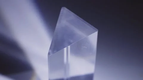 Light Refracting Through Angles Of A Triangular Prism. closeup Stock Footage 233426796