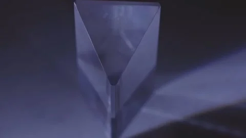 Light Refracting Through Triangular Transparent Prism With Shadow. closeup Stock Footage 233334500