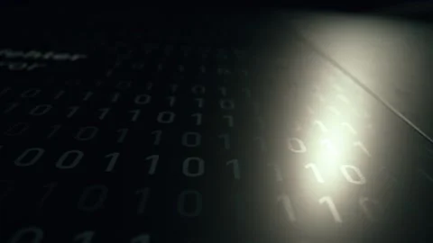 Light revealing binary code on a dark surface Stock Footage 285815946