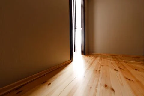 The light revealing through the half open door in the house Stock-Fotos