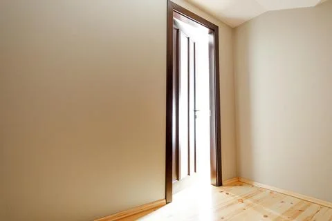 The light revealing through the half open door in the house Stock-Fotos