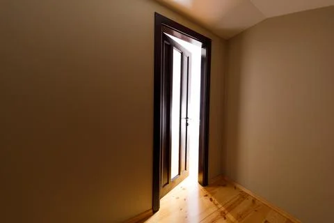 The light revealing through the half open door in the house 스톡 사진