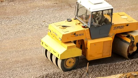 Light roller using for laying single-layer asphalt. Building industry business.  Stock Footage 117357568