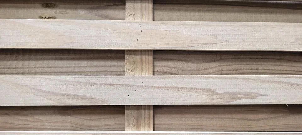 Light rustic wood background with dark veins on natural panel Stock Photos