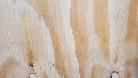 Light rustic wood panel with veins and illuminated Stock Photos