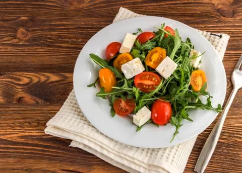 Light salad of arugula Stock Photos