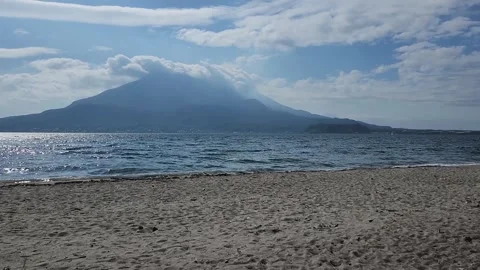 Light sand beach stretches to gentle ocean waves 動画素材 337696524