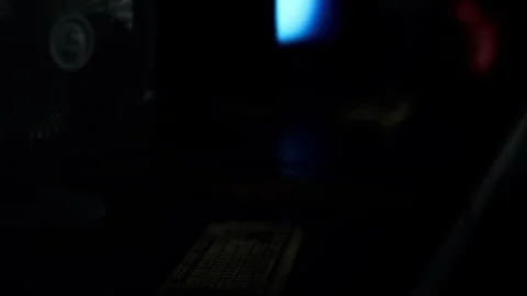 Light from screens creates shadows in dark room at night Stock Footage 344967506
