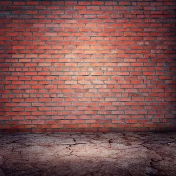 Light of a searchlight on a brick wall in an old room. Brick wall background Stock Photos