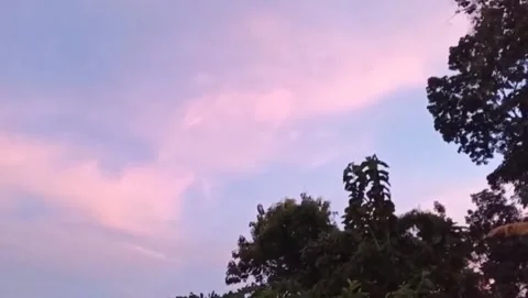 The light of the setting sun illuminated the surrounding hills. Stock Footage 325833474