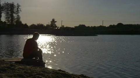 Light of a Setting Sun Illuminates a Beach Stock Footage 66285361
