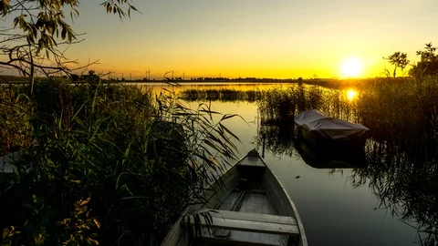 The light of the setting sun on the lake. 4K timelapse. Stock Footage 92840047