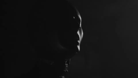 Light shaping on a scary face mask in the dark Video stock 151666465