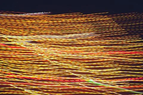 Light shine traces background. Lights trails dynamic backdrop. Night exposure Stock Photos