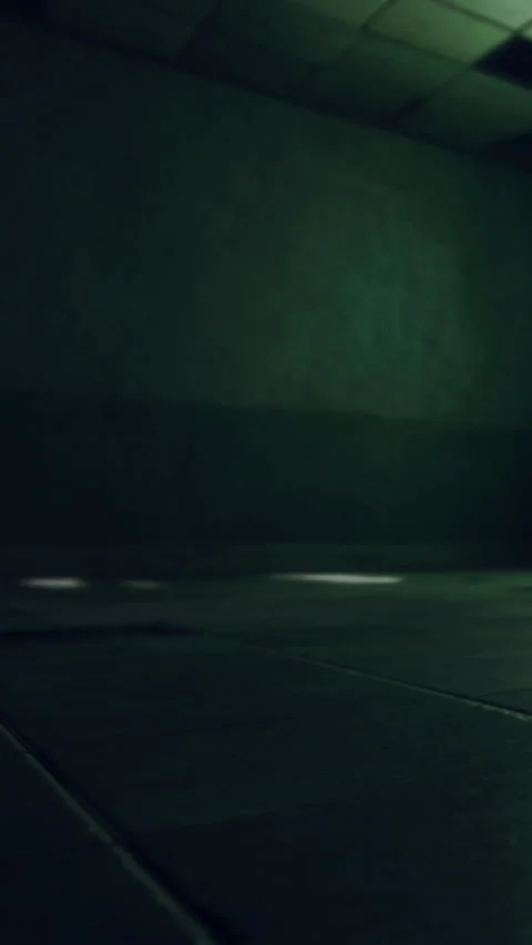 Light shines on a blank wall and floor in a dark room at night Stock Footage 337976149