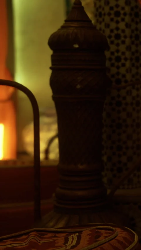 Light shines on a decorative object near a warm fire in a cozy space Stock Footage 331746968