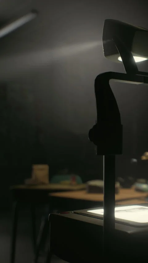 Light shines on a desk with objects in a dim classroom setting at night Stock Footage 339398318