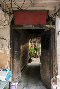 The light that shines down at the old wall of narrow street in the old wooden Stock Photos