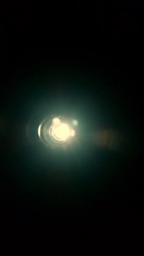 A light shines at the end of a tunnel, directly into the camera, creating a.. Video stock 296756545