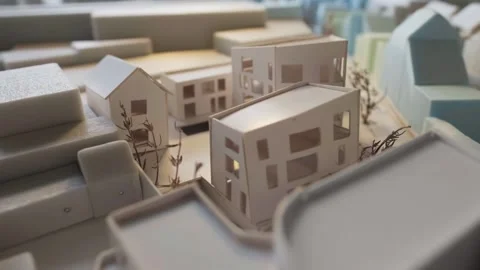 Light shines on a scale model building 스톡 동영상 288992292