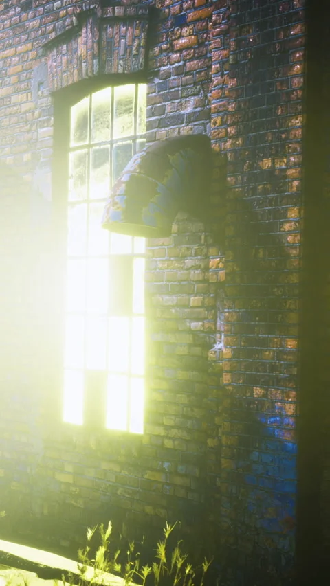Light shines through an old window in a brick building at night Stock Footage 335942793