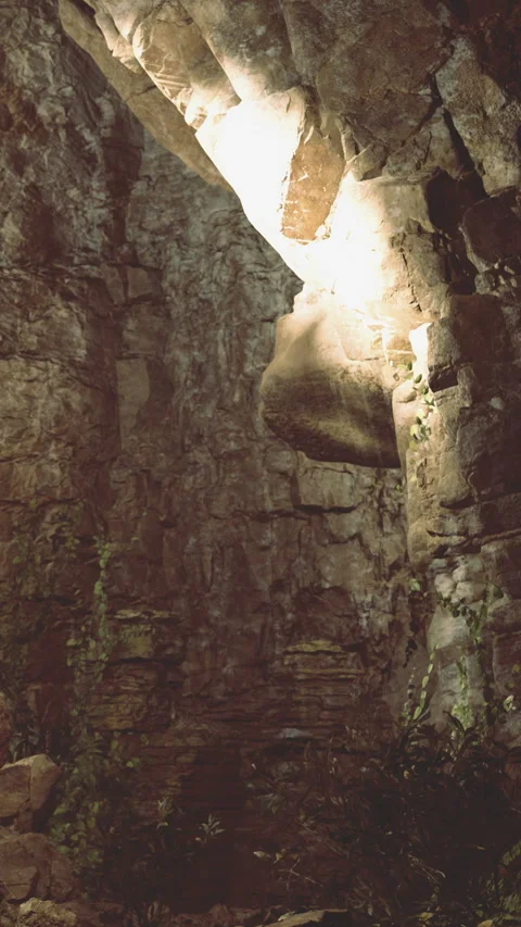 Light shines through rock formation in cave during daytime in nature Stock Footage 331747794