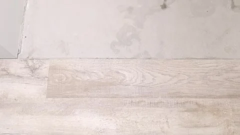 Light shines through window over wooden floor in bright indoor space during morn Stock Footage 326696588