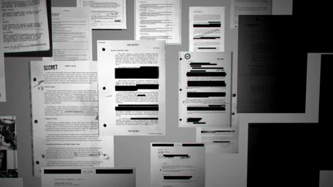 Light shining and exposing top secret official government looking censored files Stock Footage 326129151