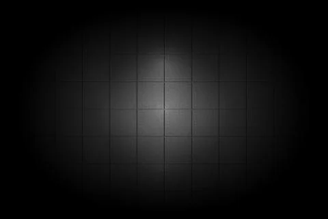Light shining down on black ceramic tile wall in dark room with copy space, a Stock Illustration