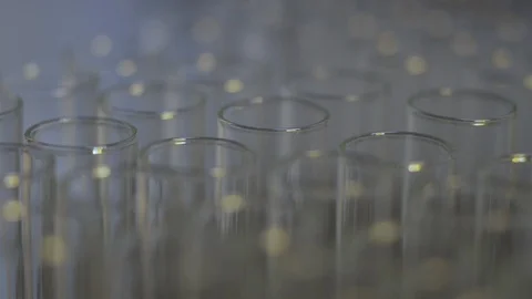 Light shining on glass test tubes in science lab Stock Footage 104076512