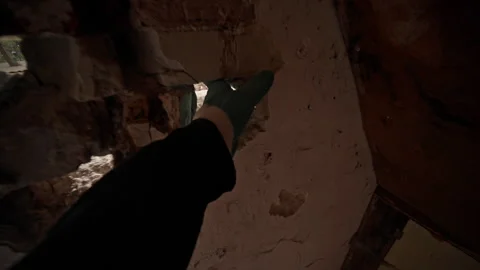Light Shining Through the Holes in an Abandoned Wall, Creating a Unique Visual Stock Footage 314568437
