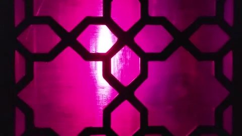 Light shining through lattice. Candle light flickering through glass. Stock Footage 315603464