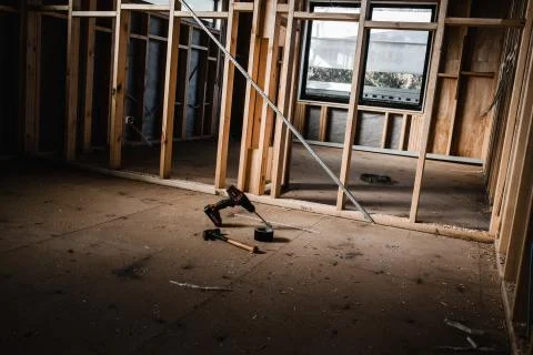 Light shining in on tools being used to build a house Stock Photos