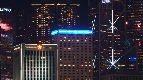 A light show is displaying on the high-rises of Hong Kong Stock Footage 124996405