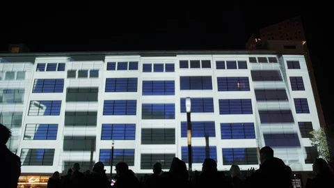 Light show on facade of large building at Glow festival in Eindhoven Stock Footage 120559979