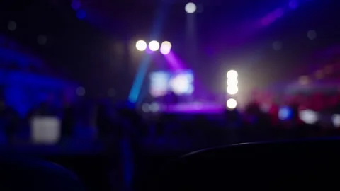 Light show in an indoor stadium. Rows of seats for spectators. Stock Footage 255424373