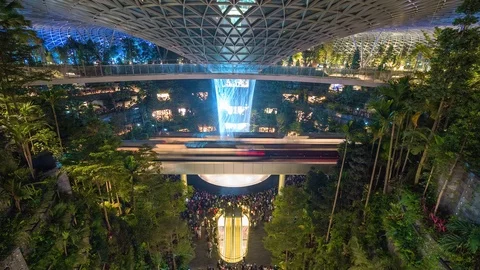 Light show in Rain vortex attraction inside newly built Changi Jewel airport Stock Footage 107074099
