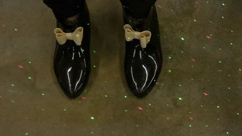 Light Show on Reflective Rubber Boots Stock Footage 92756596