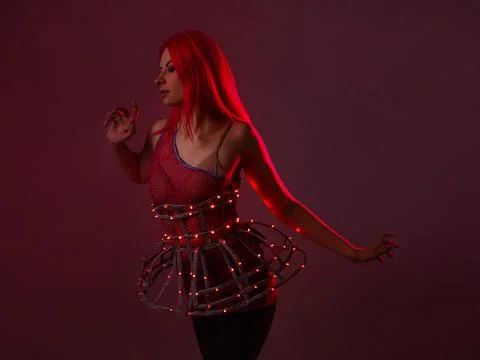 Light show, suit with LEDs. Young beautiful woman in a luminous suit Foto stock