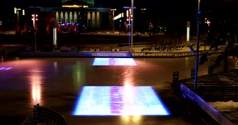 Light show at the winter ice rink in Moscow at night Stock Footage 67767032