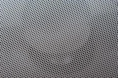 Light silver metal background with round hole and reflection Stock Photos
