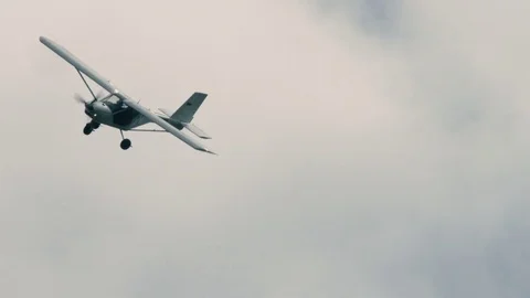 Light single aircraft in the air Stock Footage 69930313
