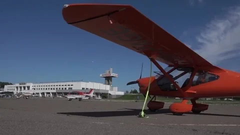 Light single-engine red aircraft on the runway. Stock Footage 183386364